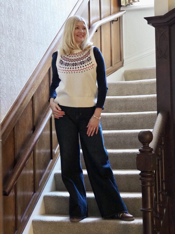Weekend outfit. Cream Fair Isle tank top with wide leg jeans, tan leather trainers and tan leather bag