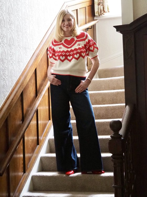 Boden Margot cotton puff sleeve knitted top cream with red hearts, wide leg jeans and red patent platform sandals